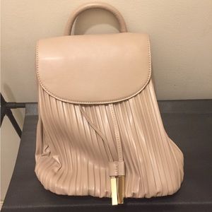 Brand new never used vegan leather backpack.